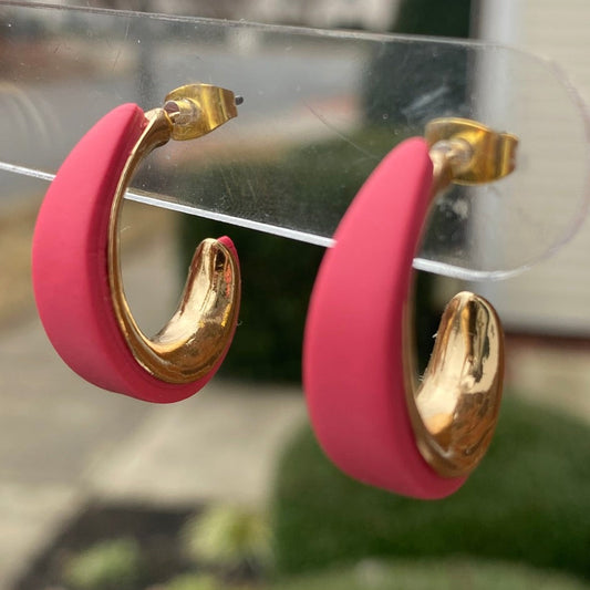 Side angle of blush pink and gold textured polymer clay hoop earrings