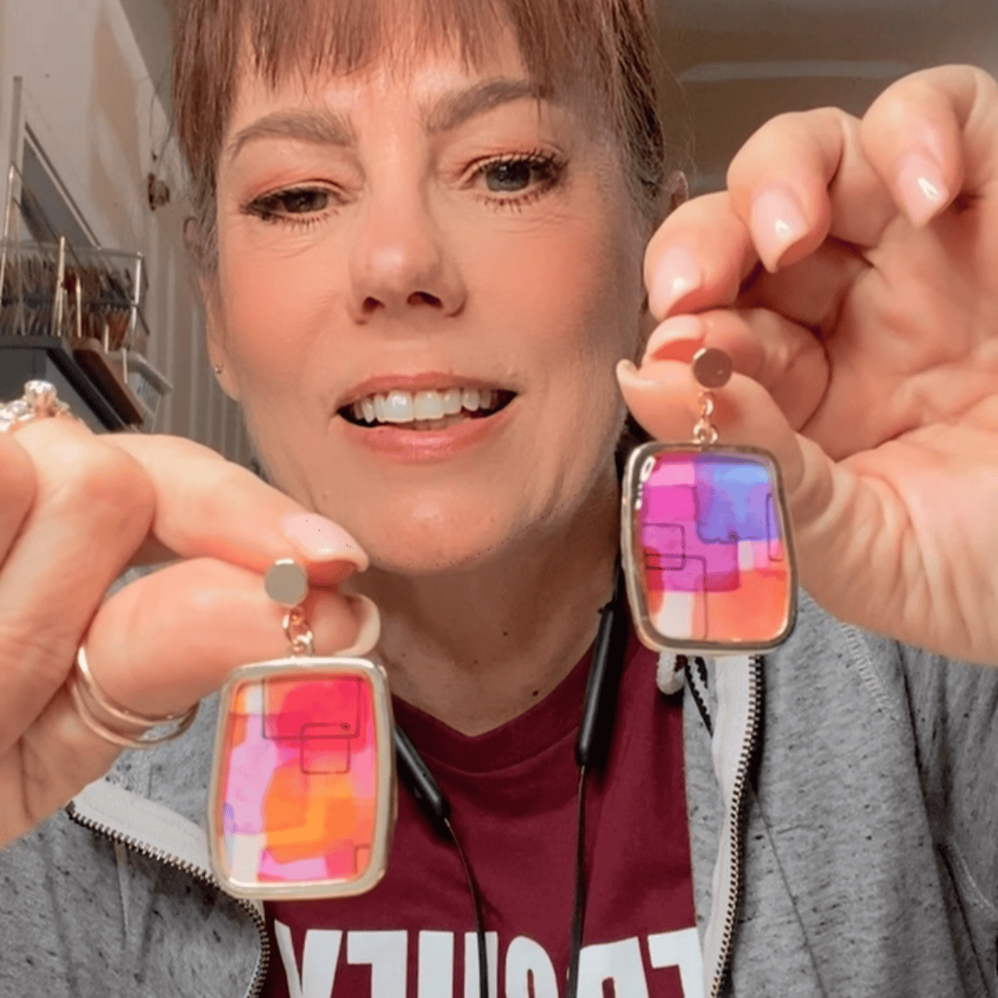 Abstract watercolor earrings displayed with natural background in Charlotte, NC