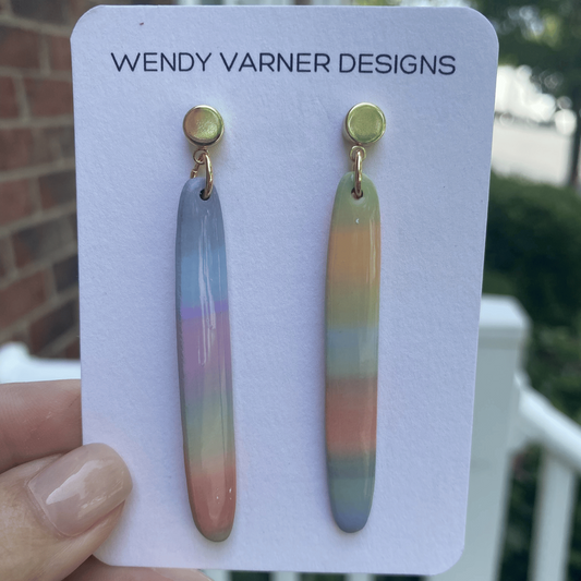 Close-up of pastel rainbow handmade polymer clay earrings with glossy finish by Wendy Varner Designs