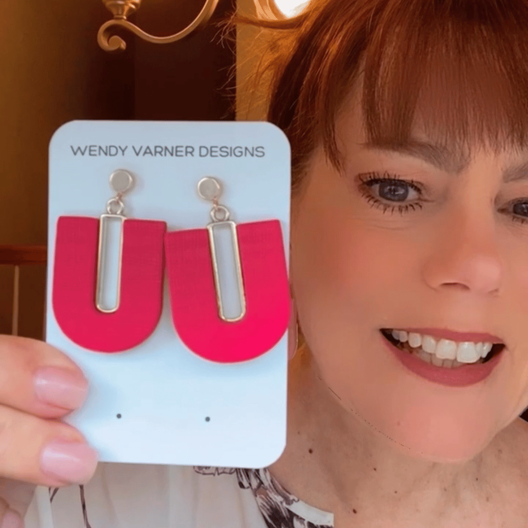 Handmade polymer clay dangle earrings in various colors and styles displayed on neutral background – Wendy Varner Designs, Charlotte NC