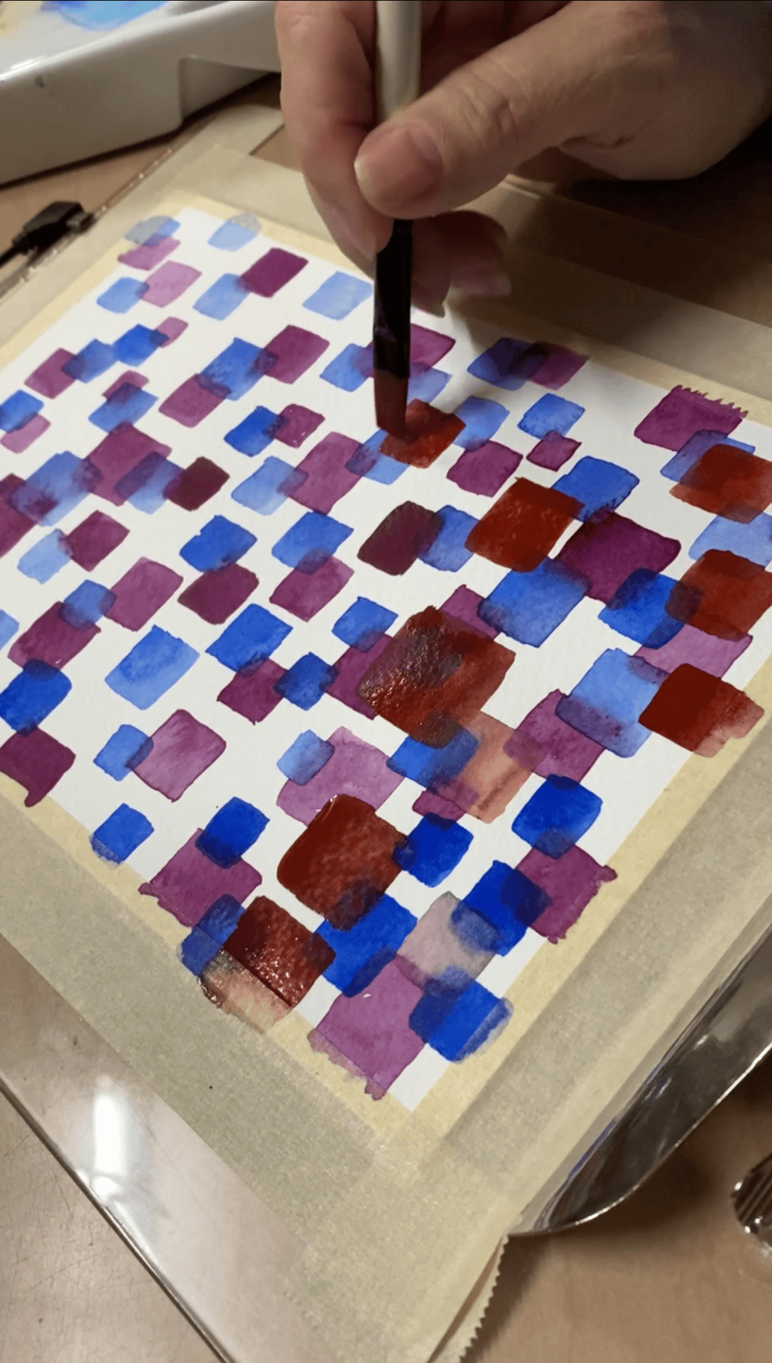 Close-up of handmade abstract watercolor earrings in gold frames by Wendy Varner Designs, part of the Watercolor Art Earrings Collection