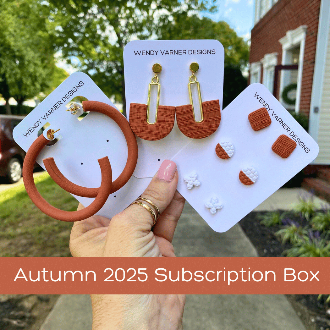 Autumn 2025 Seasons Change polymer clay subscription box with terra cotta hoops, terra cotta boho arch dangles and terra cotta and white stud earrings
