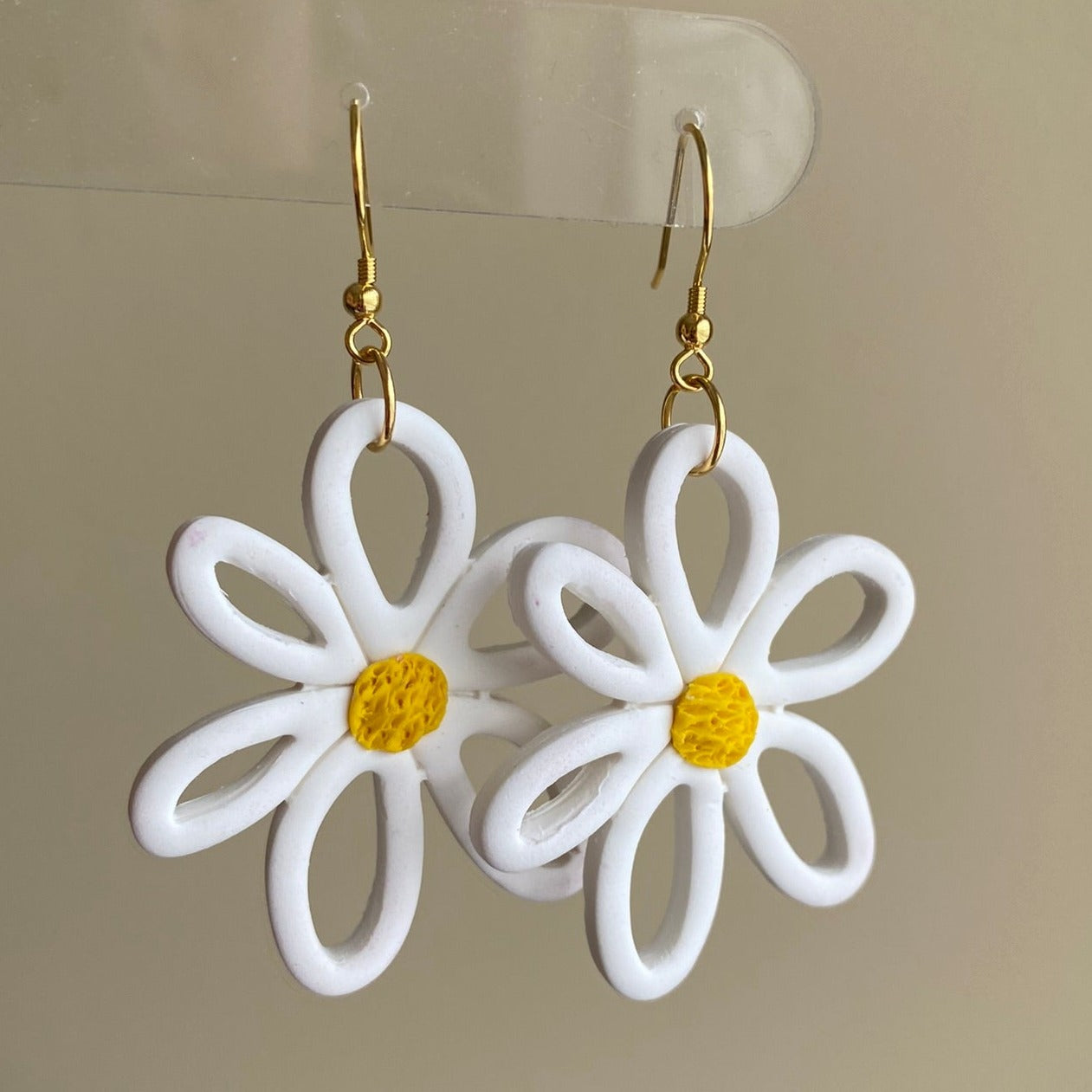 White flower daisy with yellow center polymer clay dangle earrings