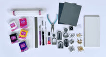 Organized polymer clay earring making kit with professional tools and materials for handmade jewelry crafting in Charlotte NC