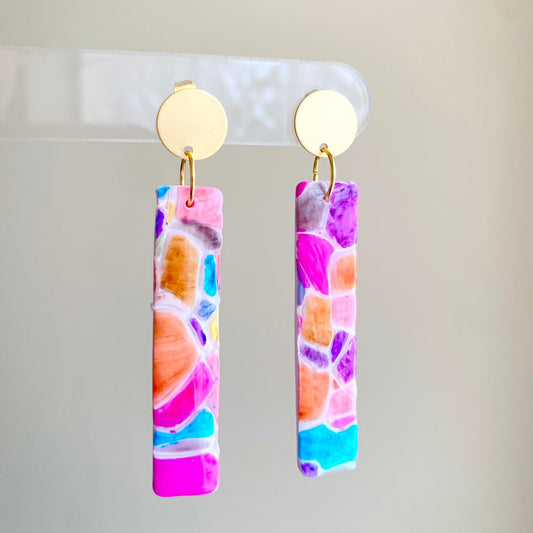 Cobble polymer clay earrings with a vibrant mosaic pattern in pink, purple, orange, and turquoise from The Brush Stroke collection