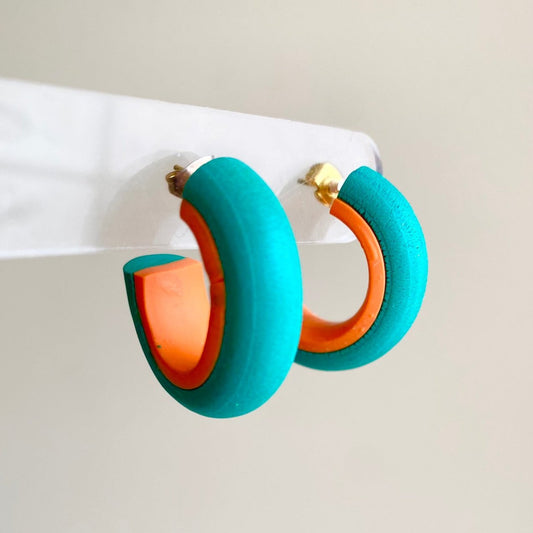 Teal and orange hoop earrings made from polymer clay, featuring a smooth, minimalist design from the Hawaiian Paradise collection.