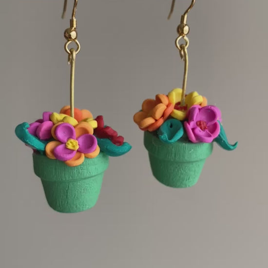 Hand-crafted polymer clay earrings shaped like green flower pots with colorful flowers, from the Hawaiian Paradise collection.