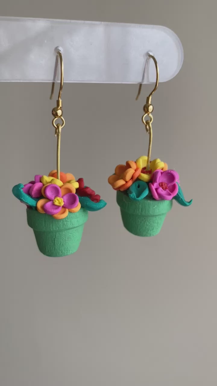 Hand-crafted polymer clay earrings shaped like green flower pots with colorful flowers, from the Hawaiian Paradise collection.