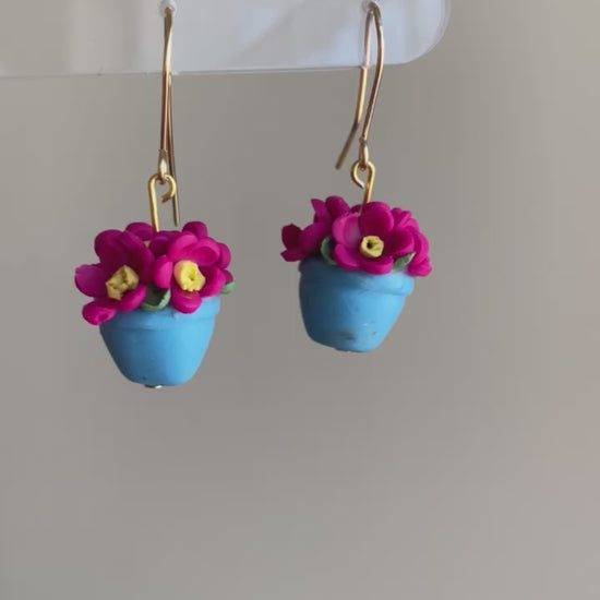 video of fuchsia pink and turquoise potted flower polymer clay dangle earrings