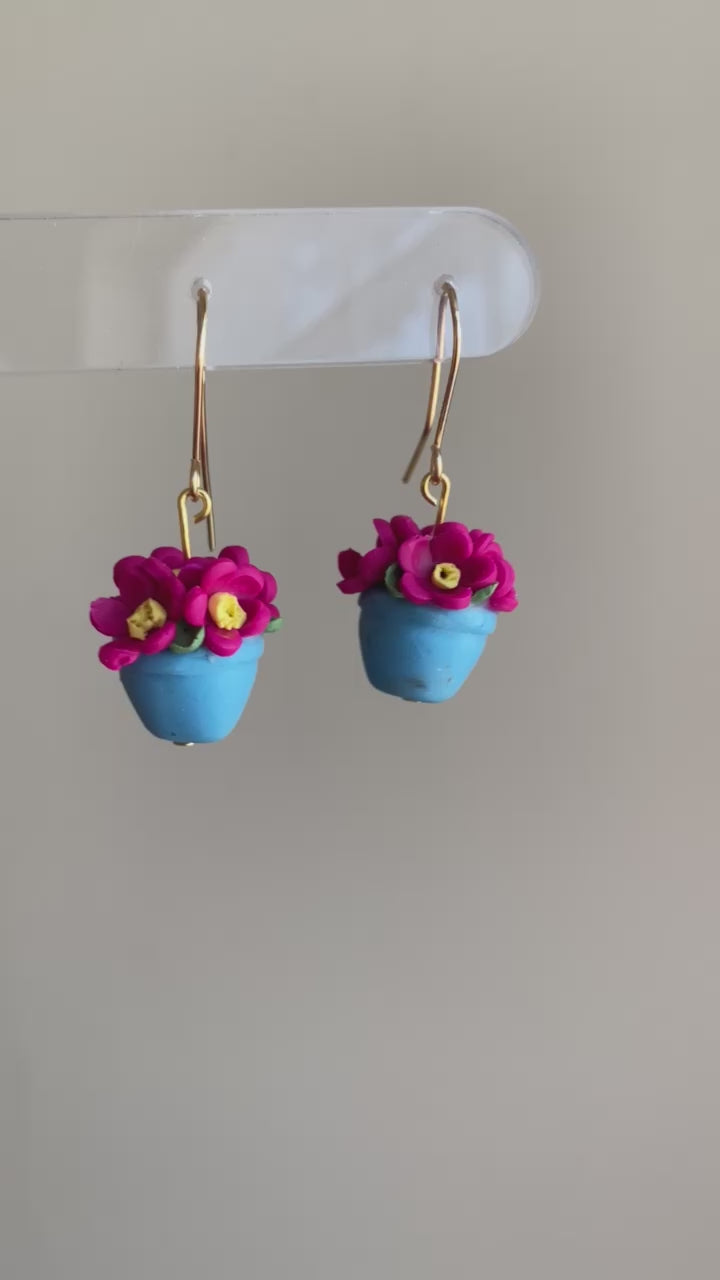 video of fuchsia pink and turquoise potted flower polymer clay dangle earrings