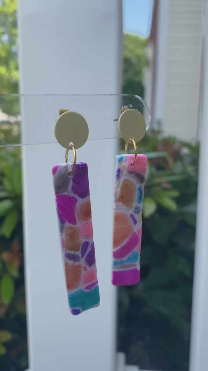 Cobble polymer clay earrings with a vibrant mosaic pattern in pink, purple, orange, and turquoise from The Brush Stroke collection