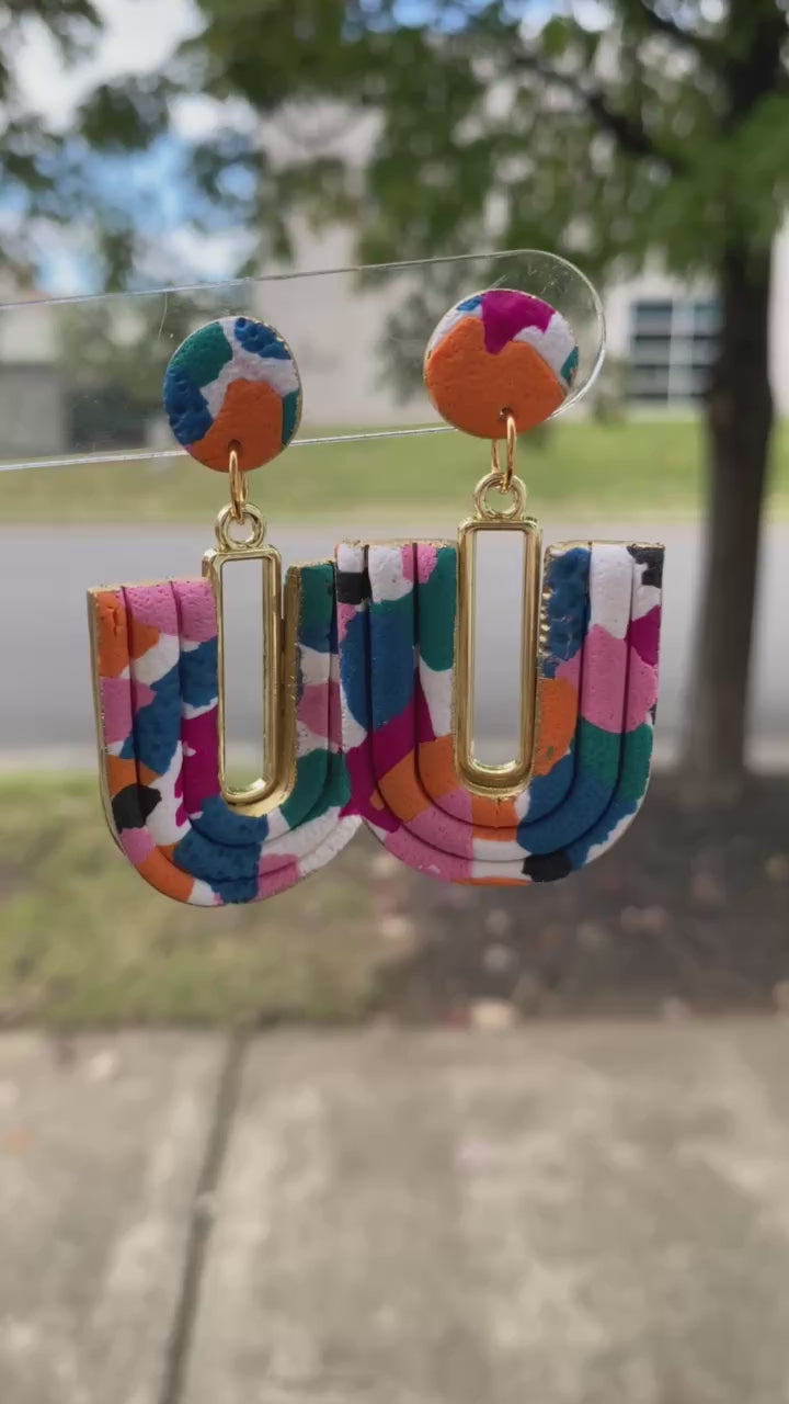Multi-colored handmade U-Loop earrings showing texture and lightweight design