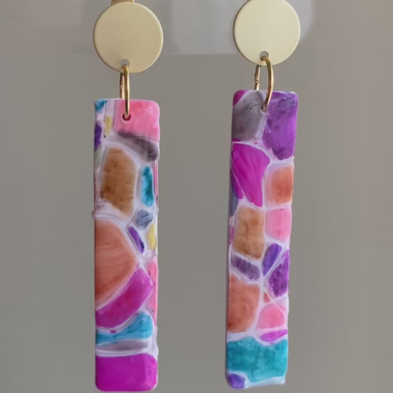 Cobble polymer clay earrings with a vibrant mosaic pattern in pink, purple, orange, and turquoise from The Brush Stroke collection