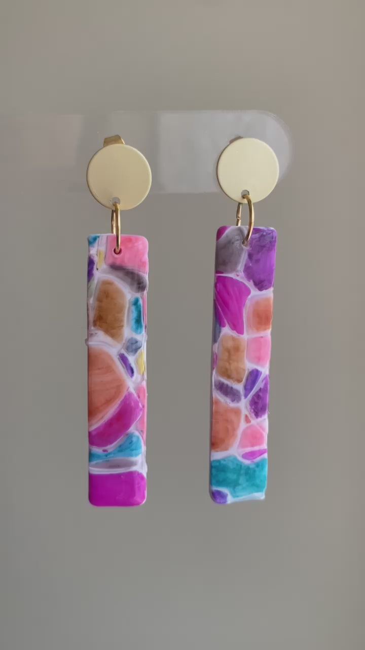 Cobble polymer clay earrings with a vibrant mosaic pattern in pink, purple, orange, and turquoise from The Brush Stroke collection