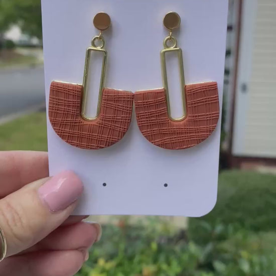 Modern terracotta arch statement earrings on Wendy Varner Designs branded card.