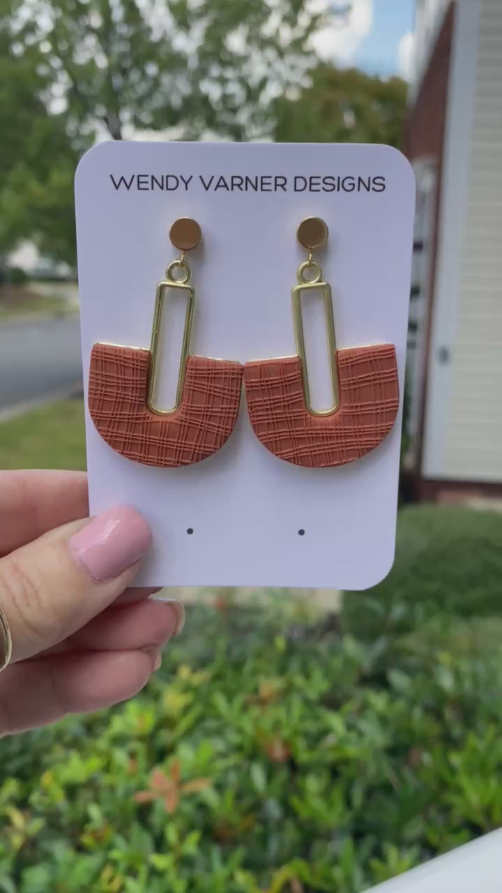 Modern terracotta arch statement earrings on Wendy Varner Designs branded card.