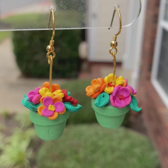 Hand-crafted polymer clay earrings shaped like green flower pots with colorful flowers, from the Hawaiian Paradise collection.