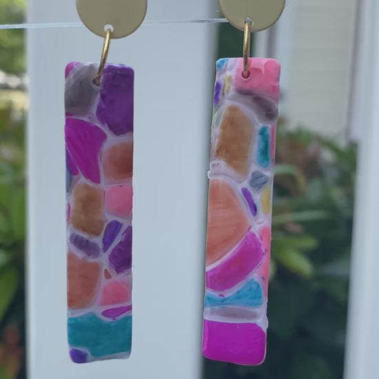 Cobble polymer clay earrings with a vibrant mosaic pattern in pink, purple, orange, and turquoise from The Brush Stroke collection