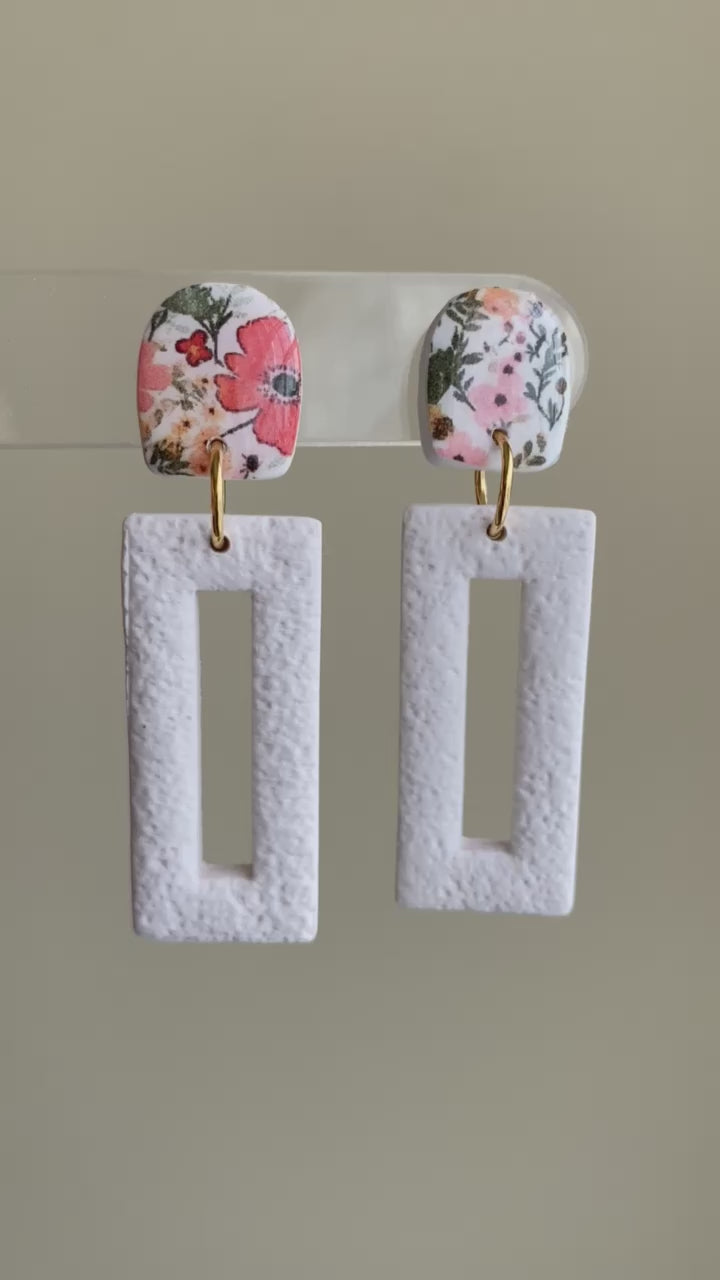 Springtime floral and textured white polymer clay dangle earrings