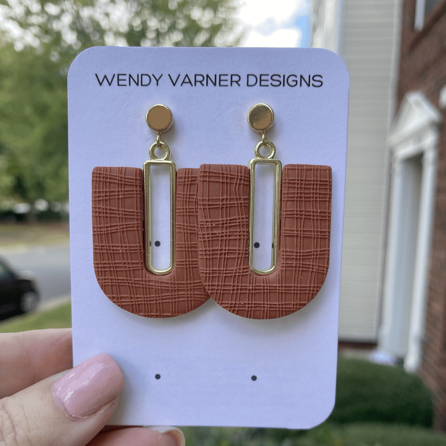 Handmade terra cotta arch polymer clay earrings with gold accents on card by Wendy Varner Designs