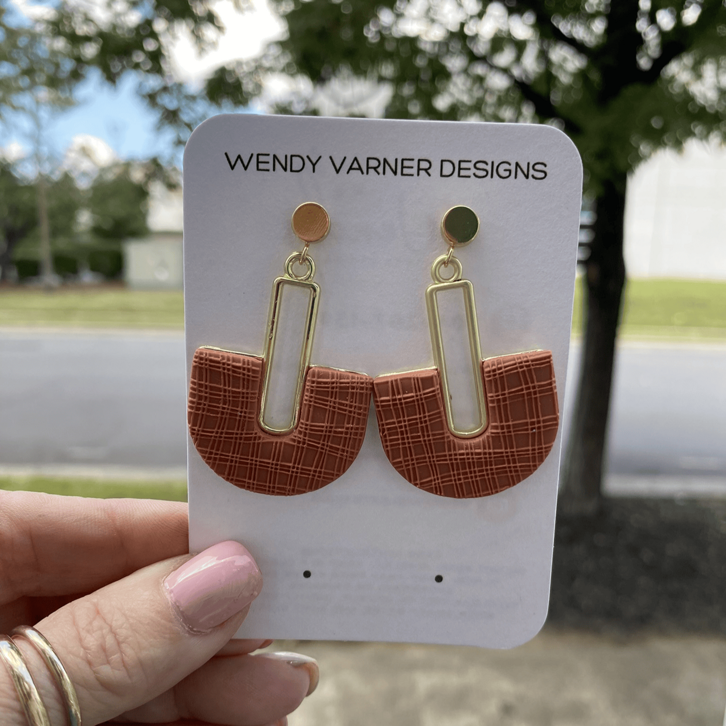 Modern terracotta arch statement earrings on Wendy Varner Designs branded card.